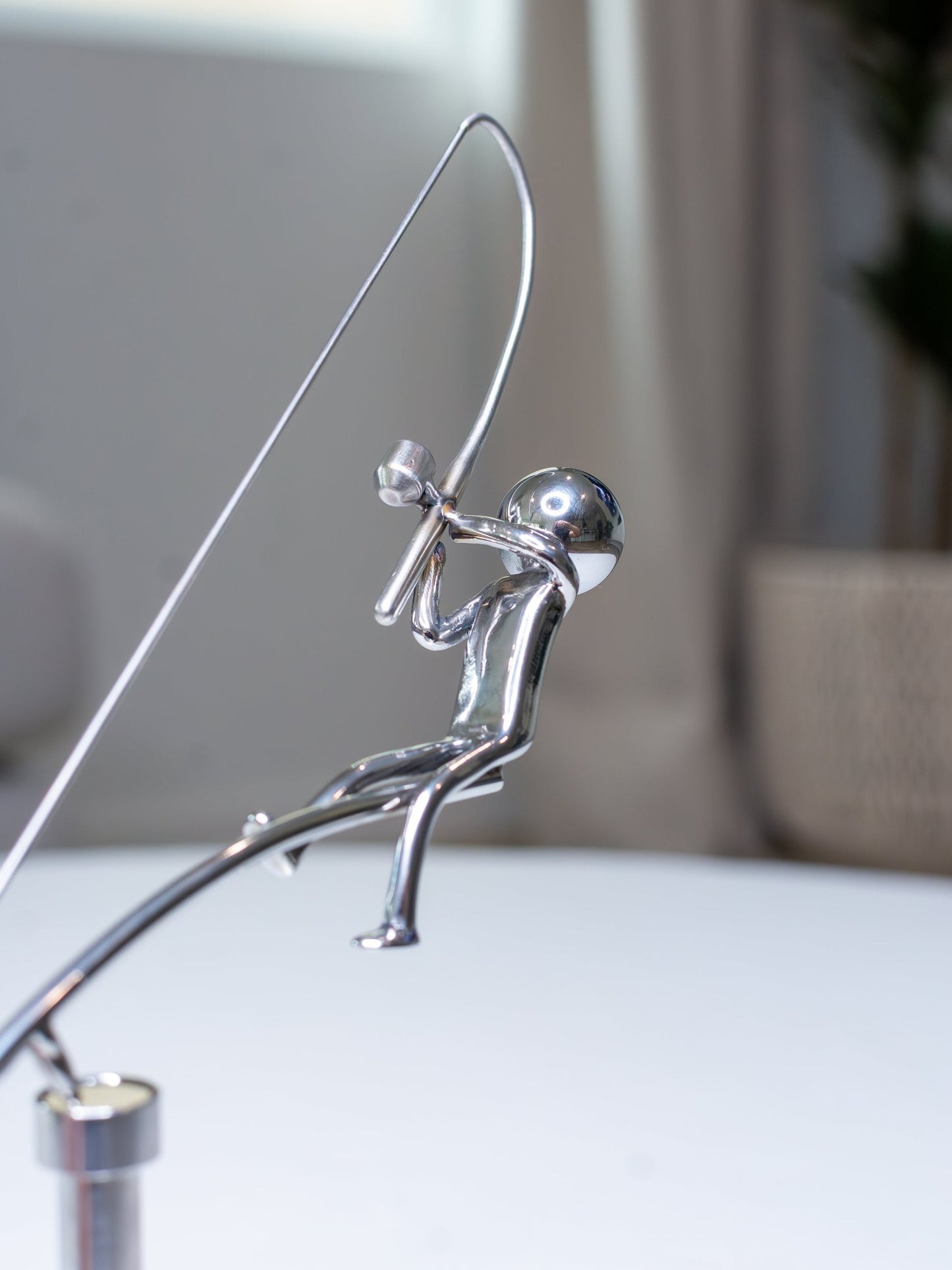 Balanssculptuur van de Visser